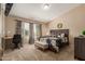 Inviting main bedroom featuring a comfortable bed, a well-lit workspace, and a serene atmosphere at 6430 E Riverdale St, Mesa, AZ 85215