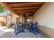 Relaxing covered outdoor patio with comfortable seating perfect for enjoying the outdoors in a private shaded setting at 6430 E Riverdale St, Mesa, AZ 85215