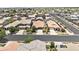 A high angle shows a neighborhood with tree-lined streets, varied architectural styles, and common green spaces at 7440 E Osage Ave, Mesa, AZ 85212