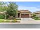 Beautiful single-story home featuring a well-maintained front yard, desert landscaping, and a two-car garage at 7440 E Osage Ave, Mesa, AZ 85212