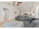 Open-concept living area with vaulted ceilings connecting the living and kitchen spaces at 7440 E Osage Ave, Mesa, AZ 85212