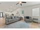 Spacious open-concept living area with tile floors connecting living and kitchen areas at 7440 E Osage Ave, Mesa, AZ 85212