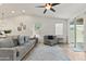 Comfortable living room with neutral tones and a view into the kitchen area at 7440 E Osage Ave, Mesa, AZ 85212