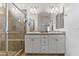 Bright and clean main bathroom featuring dual sinks and walk in shower at 7440 E Osage Ave, Mesa, AZ 85212