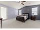 Comfortable main bedroom with a sliding glass door and neutral color scheme at 7440 E Osage Ave, Mesa, AZ 85212