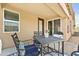 Cozy outdoor patio features an outdoor seating, a table and chairs on a tiled space, great for relaxing at 7440 E Osage Ave, Mesa, AZ 85212