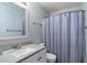 Cozy bathroom featuring a single sink, tile floors, and a shower-tub combo at 7500 E Deer Valley Rd # 54, Scottsdale, AZ 85255