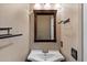 This bathroom features a decorative mirror and a single sink at 7500 E Deer Valley Rd # 54, Scottsdale, AZ 85255