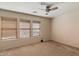 Bedroom featuring multiple windows and neutral carpeting at 7500 E Deer Valley Rd # 54, Scottsdale, AZ 85255