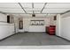 A clean and well-organized garage with ample storage cabinets and red tool chest at 7500 E Deer Valley Rd # 54, Scottsdale, AZ 85255