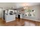 Bright kitchen with white cabinetry, stainless steel appliances, and hardwood flooring at 7500 E Deer Valley Rd # 54, Scottsdale, AZ 85255