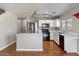 Well-lit kitchen with stainless steel appliances and an island with marble countertops at 7500 E Deer Valley Rd # 54, Scottsdale, AZ 85255