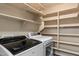 Spacious laundry room features ample shelving and modern washer and dryer at 7500 E Deer Valley Rd # 54, Scottsdale, AZ 85255