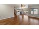 Open layout displaying the living room, kitchen, and staircase, complemented by hardwood floors at 7500 E Deer Valley Rd # 54, Scottsdale, AZ 85255