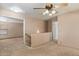Comfortable carpeted loft area featuring a ceiling fan and access to other rooms at 7500 E Deer Valley Rd # 54, Scottsdale, AZ 85255