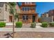 Charming three-story home featuring desert landscaping and a cozy front porch at 7732 W Bonitos Dr, Phoenix, AZ 85035
