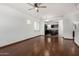 Spacious living room featuring hardwood floors, an open-concept design, and many windows at 7732 W Bonitos Dr, Phoenix, AZ 85035