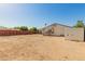 Spacious backyard with a covered patio, storage shed, and ample room for outdoor activities and customization at 7849 E Golf Ave, Mesa, AZ 85209
