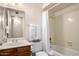 Cozy bathroom features a shower-tub combination, ample lighting, and a classic vanity at 7849 E Golf Ave, Mesa, AZ 85209