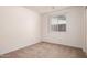 Empty bedroom featuring carpet flooring, a window, and white walls at 7849 E Golf Ave, Mesa, AZ 85209