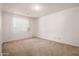 Empty bedroom featuring carpet flooring, a window, and white walls at 7849 E Golf Ave, Mesa, AZ 85209