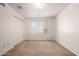 Empty bedroom featuring carpet flooring, a window, and white walls at 7849 E Golf Ave, Mesa, AZ 85209