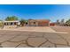 Lovely single-story home with desert landscaping and attached garage at 7849 E Golf Ave, Mesa, AZ 85209