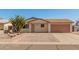 Inviting single-story home with a well-maintained front yard and attached garage at 7849 E Golf Ave, Mesa, AZ 85209