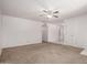 Spacious living room with neutral carpet, ceiling fan, and ample natural light at 7849 E Golf Ave, Mesa, AZ 85209