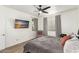 Bedroom with ceiling fan, chair, and a TV set on the wall at 8209 S 23Rd Pl, Phoenix, AZ 85042
