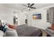 Bedroom with ceiling fan and access to bathroom and walk-in closet at 8209 S 23Rd Pl, Phoenix, AZ 85042