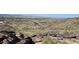 Expansive desert view from rocky elevation, showcasing the city landscape at 8209 S 23Rd Pl, Phoenix, AZ 85042