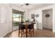 Cozy dining area with a glass sliding door and access to an outdoor space at 8209 S 23Rd Pl, Phoenix, AZ 85042