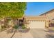 Charming single-story home with a well-maintained front yard and two car garage at 8209 S 23Rd Pl, Phoenix, AZ 85042