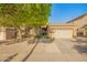 Charming single-story home with a well-maintained lawn, manicured shrubs, and a two-car garage at 8209 S 23Rd Pl, Phoenix, AZ 85042