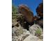 Unique natural rock formation featuring layered stones with desert greenery at 8209 S 23Rd Pl, Phoenix, AZ 85042