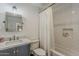Bright bathroom with subway tile shower, classic fixtures, and vanity with marble countertop at 8320 E Monte Vista Rd, Scottsdale, AZ 85257