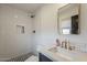 This modern bathroom features a tiled shower, stylish fixtures, and contemporary design at 8320 E Monte Vista Rd, Scottsdale, AZ 85257