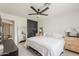 This comfy bedroom features neutral decor, a ceiling fan, and ample space for relaxation at 8320 E Monte Vista Rd, Scottsdale, AZ 85257