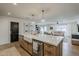 Spacious kitchen island with a farmhouse sink, ample counter space, and an open view to the living and dining areas at 8320 E Monte Vista Rd, Scottsdale, AZ 85257