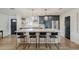 This stylish kitchen features a large island with seating, stainless appliances, and contemporary finishes at 8320 E Monte Vista Rd, Scottsdale, AZ 85257