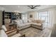 Comfortable living room featuring a sectional couch, large windows, and modern decor at 8320 E Monte Vista Rd, Scottsdale, AZ 85257