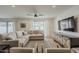 Inviting living room featuring a comfortable sectional sofa, stylish furnishings, and a modern entertainment center at 8320 E Monte Vista Rd, Scottsdale, AZ 85257