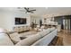 Open-concept living room with modern furnishings and a view into the kitchen at 8320 E Monte Vista Rd, Scottsdale, AZ 85257