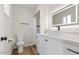 Updated bathroom featuring a lighted mirror, modern sink, and walk-in shower at 8326 E Crestwood Way, Scottsdale, AZ 85250