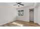 Bright bedroom with neutral walls, hardwood floors, and a large window with outdoor views at 8326 E Crestwood Way, Scottsdale, AZ 85250