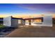 Charming single-story home with a red tile awning and white painted brick facade at 8326 E Crestwood Way, Scottsdale, AZ 85250
