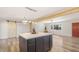 Stylish open-concept kitchen and living space with exposed beams and modern finishes at 8326 E Crestwood Way, Scottsdale, AZ 85250