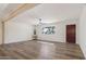 Spacious living area features stylish wood flooring, exposed beams and abundant natural light at 8326 E Crestwood Way, Scottsdale, AZ 85250