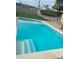 Inviting backyard pool with pristine, refreshing blue water and low-maintenance landscaping at 8326 E Crestwood Way, Scottsdale, AZ 85250